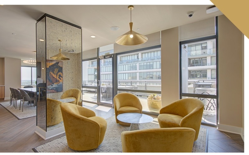 a living room with a couch and chairs