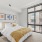 bedroom with ample space around the bed and bright lighting