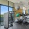 Bright, well-equipped fitness center with exercise machines with individual displays