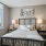 Cozy bedroom with oversized window, tree-lined views, plush carpeting and en-suite bathroom